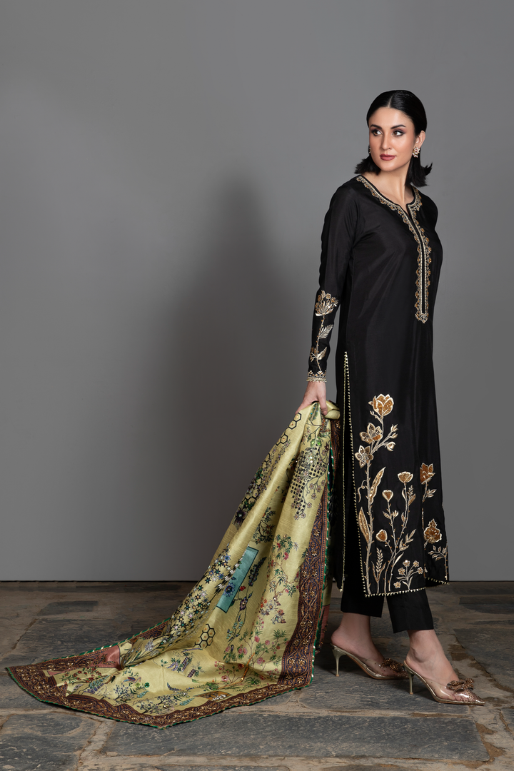 Video of Mahya black silk suit with pistachio botanical hand-embellished printed shawl.