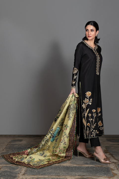 Video of Mahya black silk suit with pistachio botanical hand-embellished printed shawl.